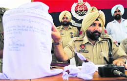 Patiala SSP Gurpreet Singh Gill shows the recovered contraband to mediapersons in Patiala on Thursday. 