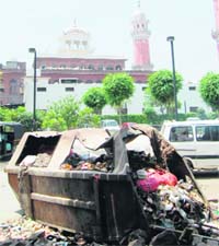 A permanent garbage dump being constructed on the Guru Ram Dass Sarai road , opposite langar hall of the Golden Temple, in Amritsar.