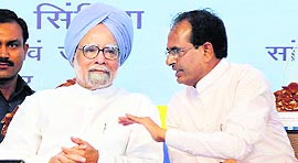 Prime Minister Manmohan Singh interacts with Madhya Pradesh Chief Minister Shivraj Singh Chouhan at the inauguration of Bina Refinery on Friday.