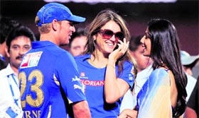 Seen here with girlfriend Liz Hurley (C), Shane Warnes face-off with the RCA took the IPL action off-field,