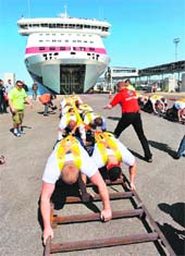 Twenty Estonian men yoked to the cruise ship Baltic Queen move the 20,000-tonne cruise ship, to set a new record, on Friday.