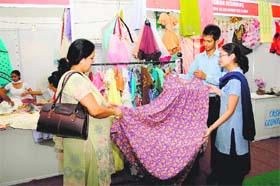 Back in business A student of vocational studies from a government school shows her work at an exhibition-cum-sale at the Panchayat Bhawan in Chandigarh