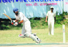 A batsman plays a shot in a match in the All-India Uttarakhand Gold Cup Cricket Tournament played at the Rangers College ground in Dehradun on Saturday.