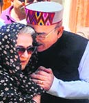 Leader of the Opposition Vidya Stokes and HPCC chief Kaul Singh Thakur on Rajiv Gandhis death anniversary in Shimla on Saturday.