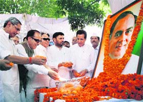 AICC general secretary Mohan Parkash (extreme left), and PCC chief Saifuddin Soz (second from left) pay tributes to former Prime Minister Rajiv Gandhi on his 20th death anniversary in Jammu on Saturday