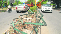 Peril beckons A mild steel railing edges out dangerously on the road separating Phases X and XI, Mohali. 