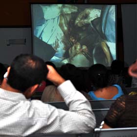 Doctors watch a live surgery on a big screen during a workshop on vaginal hysterectomy at Columbia Asia Hospital in Gurgaon on Sunday