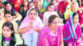 Devotees all attention to Baba Hardev Singh Maharaj, head of the Nirankari sect, in Mussoorie on Sunday.