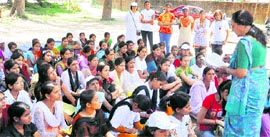Krishna Khurana, social worker, addresses students at a programme in Dehradun on Sunday.