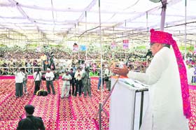 Chief Minister Bhupinder Singh Hooda addresses a rally at Adampur, near Hisar, on Sunday
