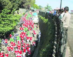 Schoolchildren participate in Green Shimla Run organised by the SJVN in Shimla on Sunday. 