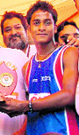 Sumit, winner of the marathon, with his trophy
