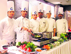 Chefs at Hotel Fortune Park Klassik prepare an Italian dish during a food festival in Ludhiana
