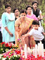 Family members and relatives of Air India crash victims pay homage during the first anniversary condolence meeting of the crash, at Kenjar-Bajpe, near Mangalore, on Sunday.