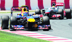 Red Bulls Sebastian Vettel (L) and Mercedes' Lewis Hamilton drive at the Circuit de Catalunya in Montmelo on the outskirts of Barcelona on Sunday