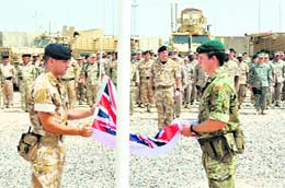 British soldiers take part in a ceremony to mark the conclusion of the British-Iraqi Training and Maritime Support Agreement in Umm Qasr close to Basra.