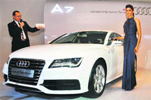 Bollywood actress Deepika Padukone and Michael Perschke, head, Audi India, at the launch of Audi 7 in Gurgaon.