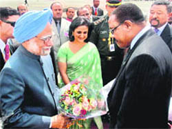 Prime Minister Manmohan Singh being welcomed by Deputy Prime Minister and Foreign Minister of Ethiopia Haliemariam Desalegn on his arrival at Bole International Airport in Ethiopia on Monday.