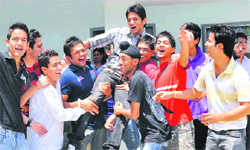Students in a jubiliant mood after the declaration of the CBSE Class XII examination results in Jalandhar on Monday.