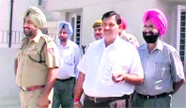 A Vigilance Bureau team outside Mantas house at Rodanwali village on Monday.