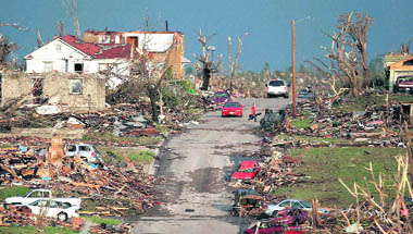 Debris dots a neighbourhood in Joplin, Missouri, after tornadoes tore through parts of the US Midwest 