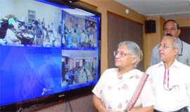 Chief Minister Sheila Dikshit admires high-definition video conferencing system at Delhi Secretariat in New Delhi on Tuesday.