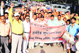 Municipal employees hold a thanksgiving rally on the elevation of the Haridwar Municipal Committee to corporation status in Haridwar on Tuesday.