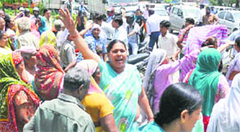 Old-age pensioners block traffic in Faridabad on Tuesday.