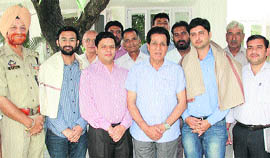 RS Chib, Minister for Medical Education, with Sarvjeet Soodan (second from right) and Bhupinder Kumar (second from left), both residents of RS Pura
