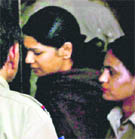 DMK MP Kanimozhi (C) arrives at Patiala House court in New Delhi on Tuesday
