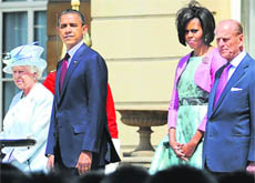 US President Barack Obama and Michelle Obama stand alongside Queen Elizabeth and The Duke of Edinburgh at Buckingham Palace in London 