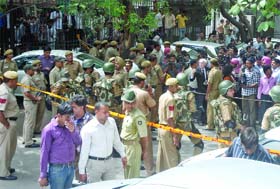 Police cordons off the site of a blast outside the Delhi High Court in New Delhi on Wednesday