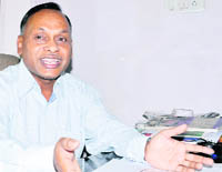 Sunil Aggarwal, secretary of the Association of Self-Financed Institutes, addresses a press conference in Dehradun 
