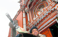 A CRPF jawan stands guard outside the Raghunath Temple in Jammu on Wednesday
