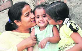 THREE IS COMPANY Kiran (left) and her thalassaemic daughter Vanshita (right) kiss Ragini, also suffering from the disease, whose mother left her after learning about her ailment