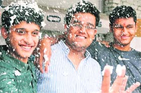 IN BIG LEAGUE From (left) Atabak, Kanav Rampal and Atish Goyal, three toppers of the city, celebrate by sprinkling synthetic froth on another in Ludhiana