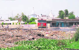 A garbage dump opposite Kali Mata Mandir dharamshala at Malerkotla. 