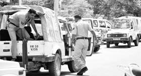 Haryana policemen rush towards jeeps during a mock drill organised at the Sector 7 police station in Panchkula on Thursday.