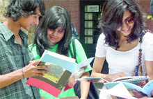 Students scan the admission forms after purchasing them on the first day at St. Stephens College in Delhi. 