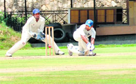 A batsman plays a shot in a match in the All-India Uttarakhand Gold Cup Cricket Tournament in Dehradun on Wednesday.