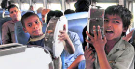These boys seek alms by entertaining people in a train at Sonepat railway station.