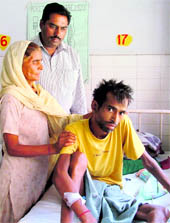 Hansraj, a resident of Kakowal village, along with his mother at the Civil Hospital in Ludhiana
