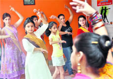 Mahua Shankar (in white suit), an international kathak dancer, teaches dance skills to women and girls during a five-day workshop in Ludhiana on Thursday