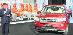 Jaguar-Land Rover CEO Ralph Speth speaks next to a Land Rover Freelander II SUV vehicle during the inauguration of the Jaguar - Land Rover manufacturing plant at Pimpri, Maharashtra