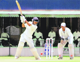 In full swing A batsman attempts a shot on the second day of the match between Mohali and Jalandhar at the PCA Stadium, Mohali, on Friday.