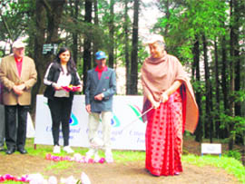 Governor Margaret Alva teeing off to inaugurate the Governors Golf Cup tournament at Raj Bhawan, Nainital, as Union Minister for Renewable Energy Farooq Abdullah (extreme left) watches on Friday.