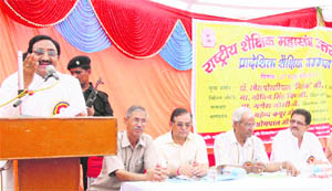 Chief Minister Ramesh Pokhriyal Nishank addresses a convention of the Rashtriya Shikshak Mahasangh in Dehradun on Friday.