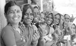Women beaming after exercising their franchise in an Indian village