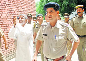 Bali Pehalwan, a former MLA of the INLD from Meham, being taken to a court in Rohtak on Saturday. Bali, an accused in a murder case, was remanded in two-day police custody