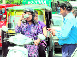 On a hot day, sweetened water being offered to passersby near the Shaurya Motor chowk in Jammu on Saturday
